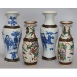 An early 20th century pair of crackle glazed vases and a pair of blue and white vases H.29cms