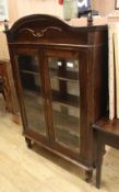An Italian glass fronted bookcase W.99cm