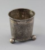 An 18th century Scandinavian? silver beaker, with textured body, on three ball feet, maker's mark TS
