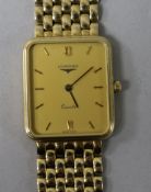 A gentleman's 9ct gold Longines Quartz wrist watch, on a 9ct Longines bracelet, with boxes.