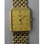 A gentleman's 9ct gold Longines Quartz wrist watch, on a 9ct Longines bracelet, with boxes.