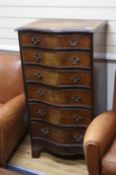 A walnut serpentine fronted chest of six drawers W.60cm