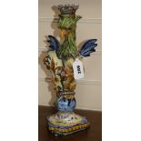 A Cantagalli maiolica griffin candlestick