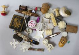 A collection of 19th century mop/ivory etc, carved pin cushions and sewing items