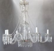 A Georgian style cut and moulded glass five light chandelier, with beaded swags and spear shaped