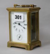 A brass carriage alarm clock 12cm.