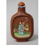 A Chinese Yixing enamelled snuff bottle, 19th century 7.5cm.