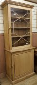 A stripped pine 2 section cupboard W.87cm