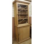 A stripped pine 2 section cupboard W.87cm