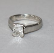 A modern platinum and radiant cut solitaire diamond ring, of good colour and clarity, the stone