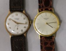 A gentleman's 18ct gold Longines manual wind wrist watch and a yellow metal Realm wrist watch.