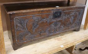 A later carved oak coffer W.117cm