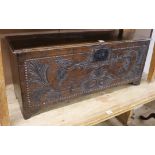 A later carved oak coffer W.117cm