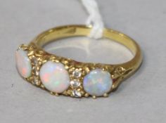 An 18ct gold, white opal and diamond half hoop ring, size O.