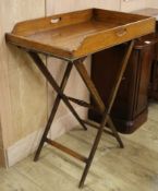 A Victorian oak butler's tray, on turned stand W.76cm