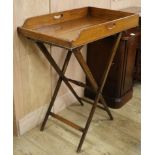 A Victorian oak butler's tray, on turned stand W.76cm