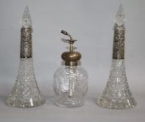 A pair of silver mounted cut glass scent bottles and an atomiser.
