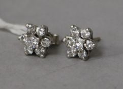A pair of 18ct white gold and diamond cluster ear studs (one butterfly missing).