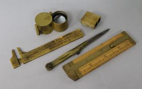 Four 19th century brass drawing instruments and a brass jeweller's loop (5)