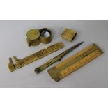 Four 19th century brass drawing instruments and a brass jeweller's loop (5)