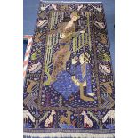 A Persian rug woven with two figures 203 x 114cm