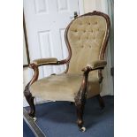 A Victorian walnut open armchair
