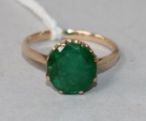 A yellow metal and emerald ring, size J.