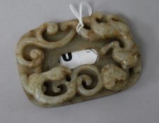 A Chinese celadon and russet jade chilong plaque, Ming dynasty 8.5cm.