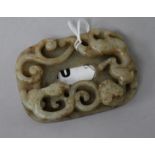 A Chinese celadon and russet jade chilong plaque, Ming dynasty 8.5cm.