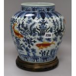 A Chinese blue and white fish pattern vase on stand H. 28cm inclding stand