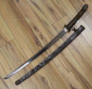 A WW2 Japanese katana with standard mounts, the blade with wavy hamon 98cm