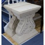 A pair of carved stone shaped columns W.64cm