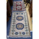 A red and cream ground rug and another 122 x 81cm, 108 x 78cm