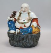 A Chinese figure of buddha H.26cm