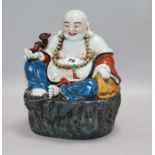 A Chinese figure of buddha H.26cm