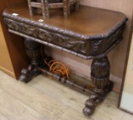 A late Victorian carved oak table W.91cm