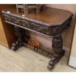 A late Victorian carved oak table W.91cm