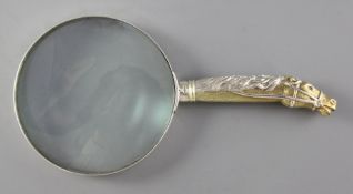 A modern parcel gilt silver mounted novelty magnifying glass, the handle modelled as the head and