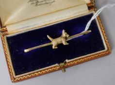 An early 20th century 9ct gold Scottie dog bar brooch.