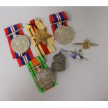 Four WW2 medals, three to the name on the box B.A. Ingram, a silver ARP badge, a silver RAF brooch