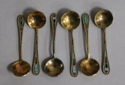 Six mid 20th century Soviet 875 zolotnik silver gilt and enamel salt spoons.