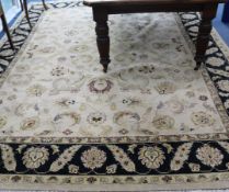 A Tabriz style carpet, with field of palmette scrolls on a beige ground, 12ft 2in. x 9ft 1in.