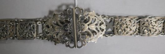 An Edwardian pierced silver belt, Birmingham, 1902 with three replacement metal links, 77cm.