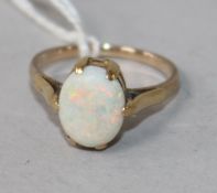 A yellow metal and white opal ring, size O.