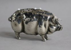 An Edwardian silver pig pin cushion by Levi & Salaman, Birmingham, 1904, length 7cm.