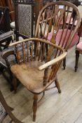 An early 19th century ash and elm Windsor armchair, stamped Nicholson , Rockley