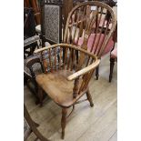 An early 19th century ash and elm Windsor armchair, stamped Nicholson , Rockley