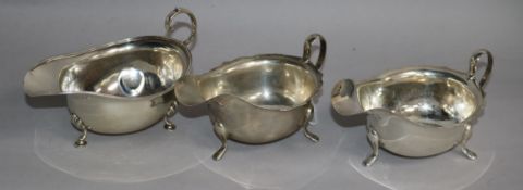 A pair of 1950's silver sauceboats and an earlier silver sauceboat. 9.5 oz.