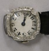 A lady's platinum and diamond cocktail watch, with Arabic dial and fabric strap.