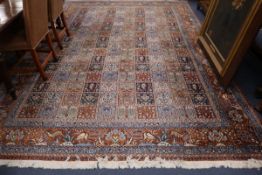 A Persian wool tile pattern carpet, 246 x 350cm